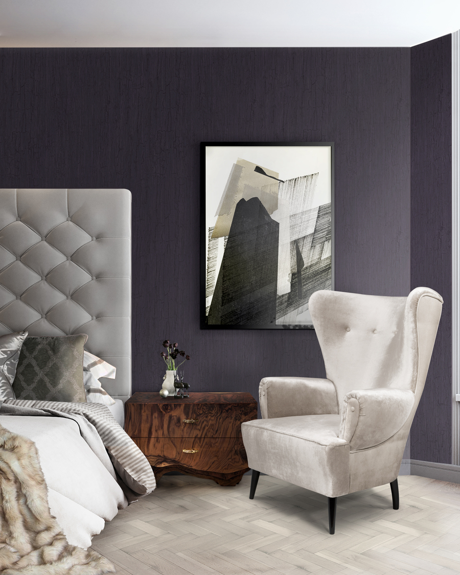 bedroom with dark blue wall and big white armchair