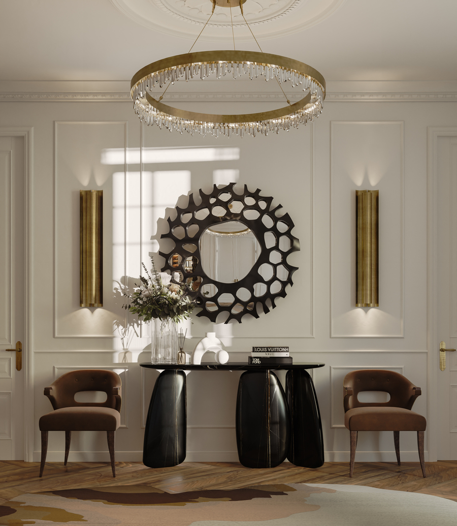 sophisticated entryway design with a round mirror and two brown velvet dining chairs