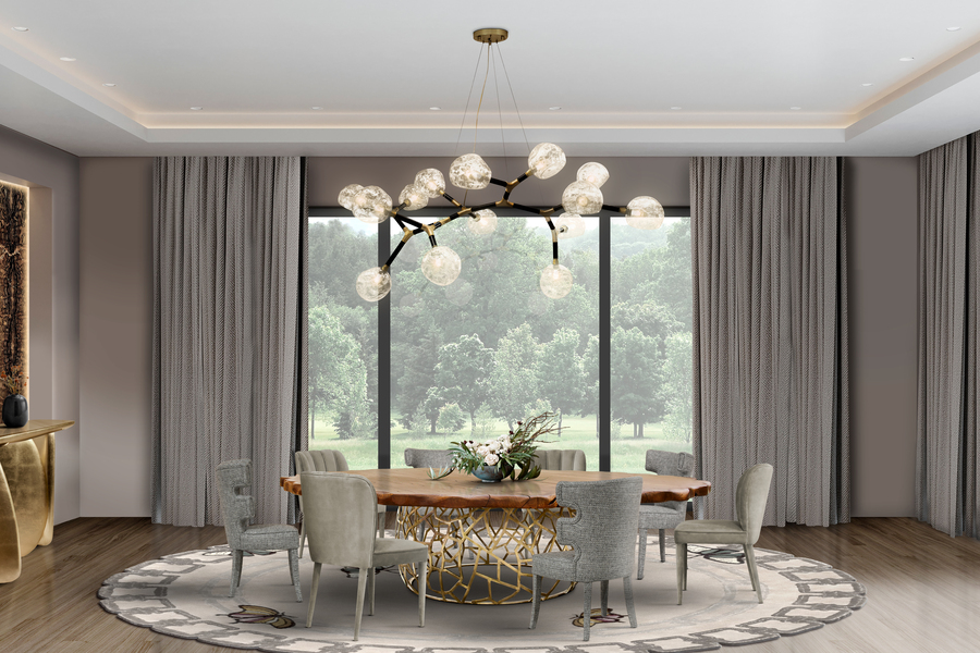 modern dining room with gold table and grey upholstered dining chairs