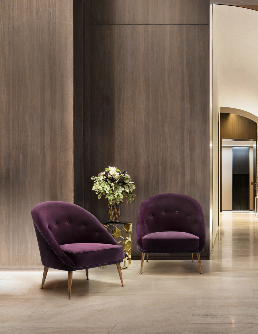 modern entryway design with two bold curved back armchairs